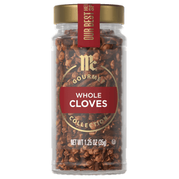 A jar of McCormick Gourmet Whole Cloves Collection is displayed, showcasing the brand and product.