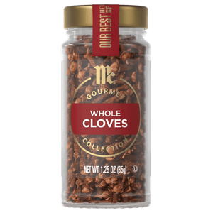A jar of McCormick Gourmet Whole Cloves Collection is displayed, showcasing the brand and product.