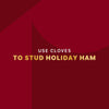 A festive red background with text that encourages the use of cloves to stud a holiday ham.