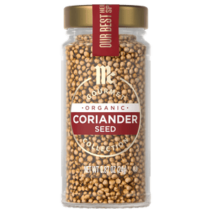 A glass jar of McCormick Gourmet Organic Coriander Seed.