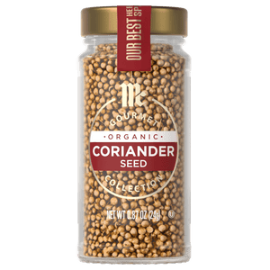 A glass jar of McCormick Gourmet Organic Coriander Seed.