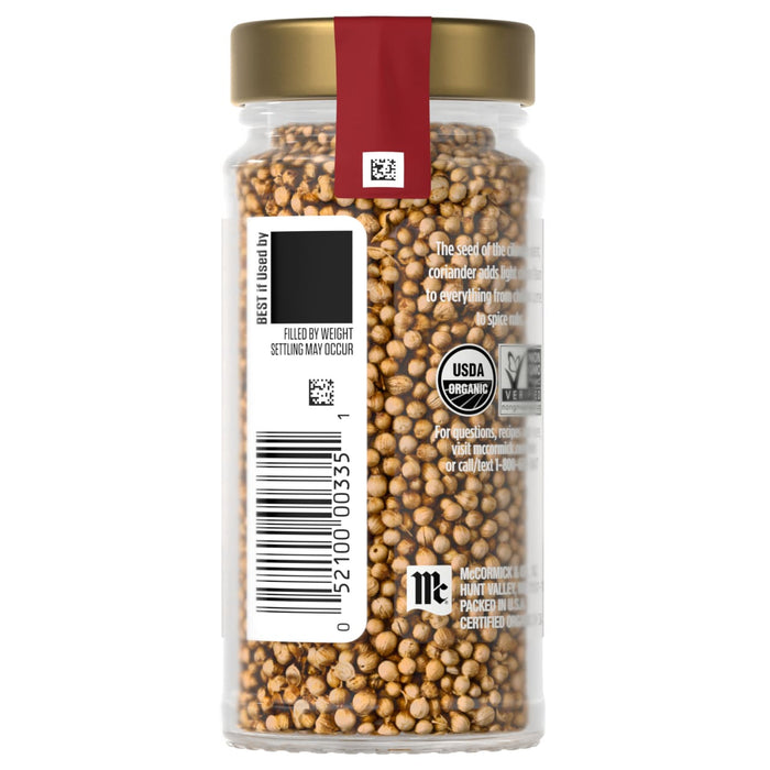 A jar of McCormick Organic Whole Mustard Seed with a label showing a barcode and organic certification.