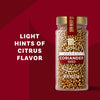 The image showcases McCormick Gourmet Coriander Mild spice in a glass jar, highlighting its light citrus flavor.
