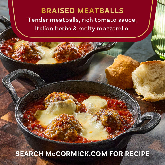 McCormick's braised meatballs with rich tomato sauce, Italian herbs, and melted mozzarella, served in small cast iron skillets.