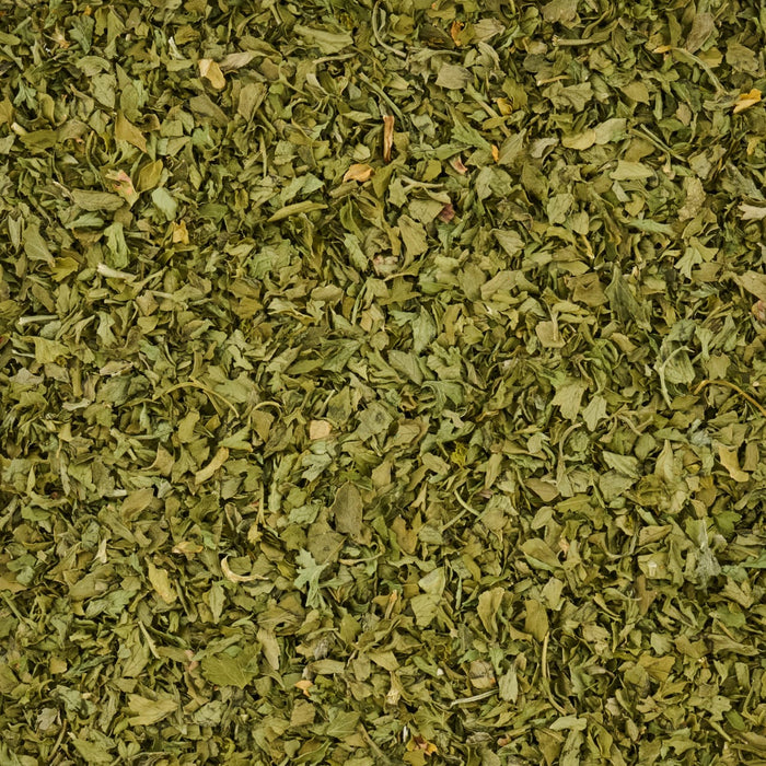 A close-up view of dried parsley flakes.