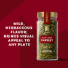 A jar of The Spice Hunter Flat Leaf Parsley is shown, highlighting its mild, herbaceous flavor and visual appeal.