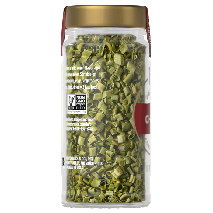 A jar of McCormick chives is shown, filled with dried green chives.