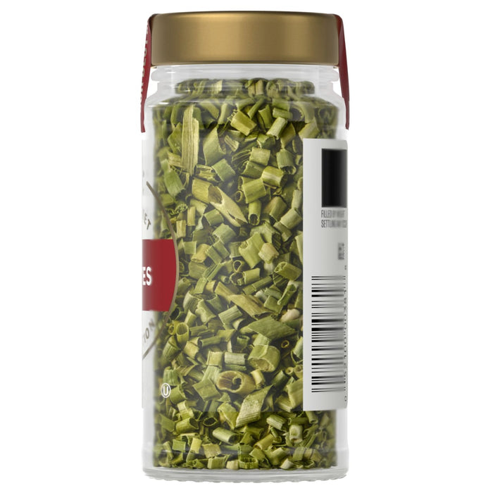 A jar of McCormick chives is shown, filled with dried green chives.