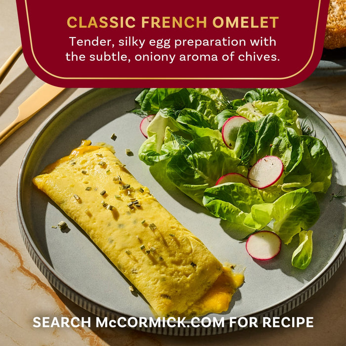 A McCormick Classic French Omelet is presented with a side salad, showcasing a tender and silky egg preparation.