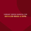 A vibrant green garnish for deviled eggs and dips is displayed against a deep red background.