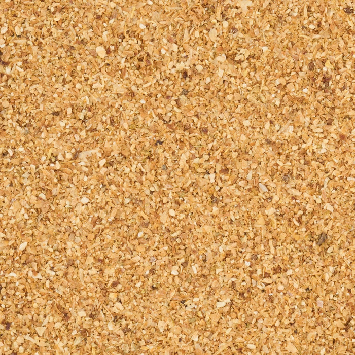 A close-up view of coarse, golden-colored sand.