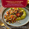 A plate of McCormick's Tomatillo, Black Bean &amp; Avocado Salad is shown, a vibrant salad brightened with the aromatic touch of dried cilantro.