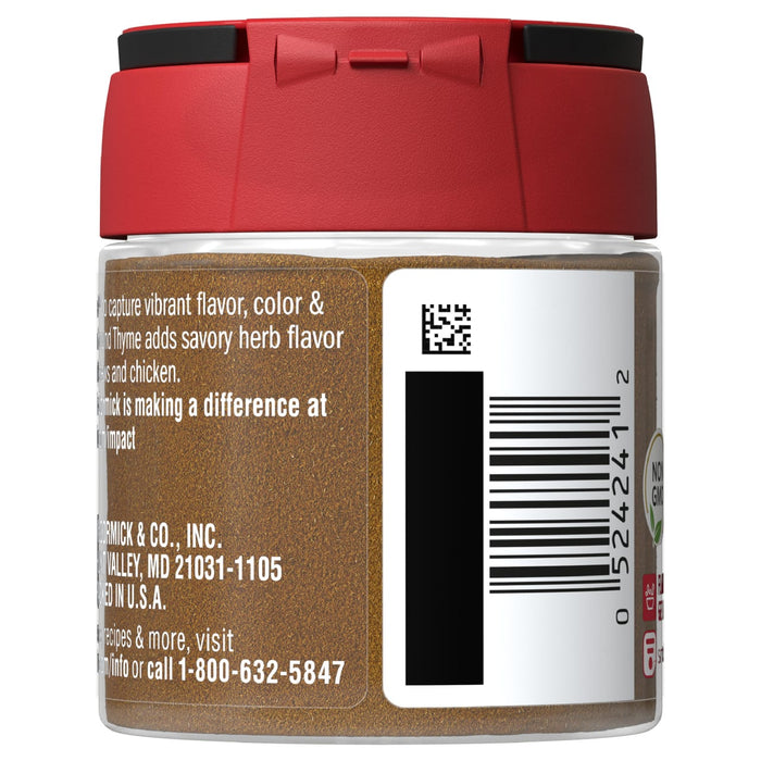 A glass jar of McCormick Thyme with a red lid and a barcode on the side.