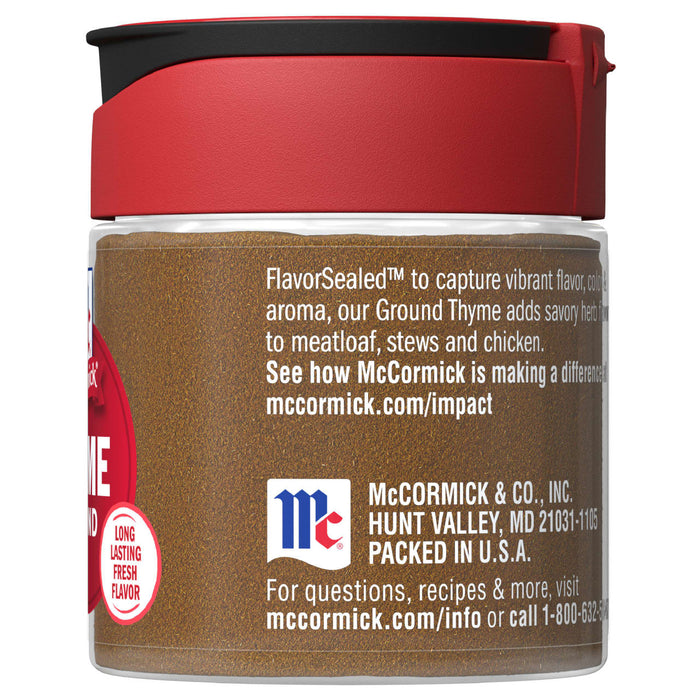 A McCormick Ground Thyme spice jar with a red lid.
