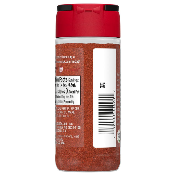A red plastic jar of McCormick Chili Pepper seasoning.