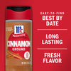 A McCormick Cinnamon Ground spice jar with a red lid and a white label with the McCormick logo and the words Cinnamon Ground in bold.