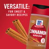 A jar of McCormick Cinnamon Ground with cinnamon sticks in the foreground.