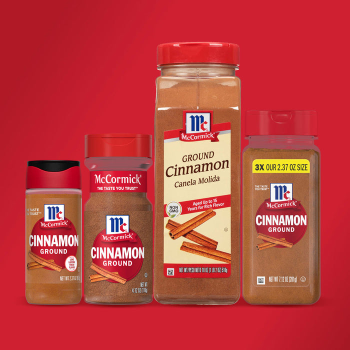 Four different sizes of McCormick Cinnamon Ground spice jars are shown on a red background.