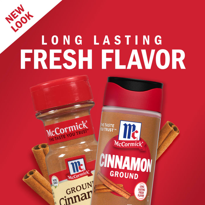 Two McCormick Cinnamon containers with cinnamon sticks on a red background.