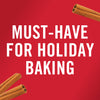 Cinnamon sticks on a red background with the text Must-Have for Holiday Baking.