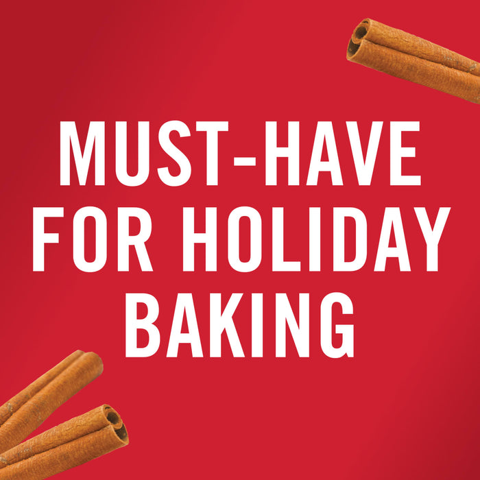 Cinnamon sticks on a red background with the text Must-Have for Holiday Baking.