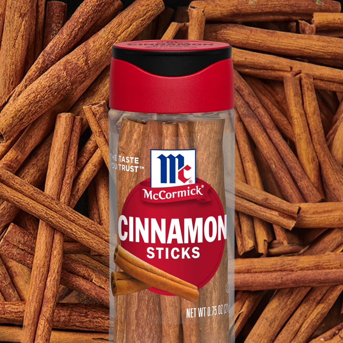 A container of McCormick Cinnamon Sticks is displayed against a background of cinnamon sticks.