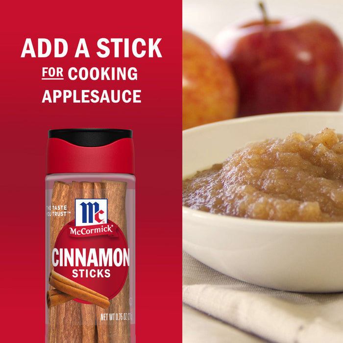 A McCormick Cinnamon Sticks container is featured next to a bowl of applesauce, suggesting adding a stick for cooking applesauce.