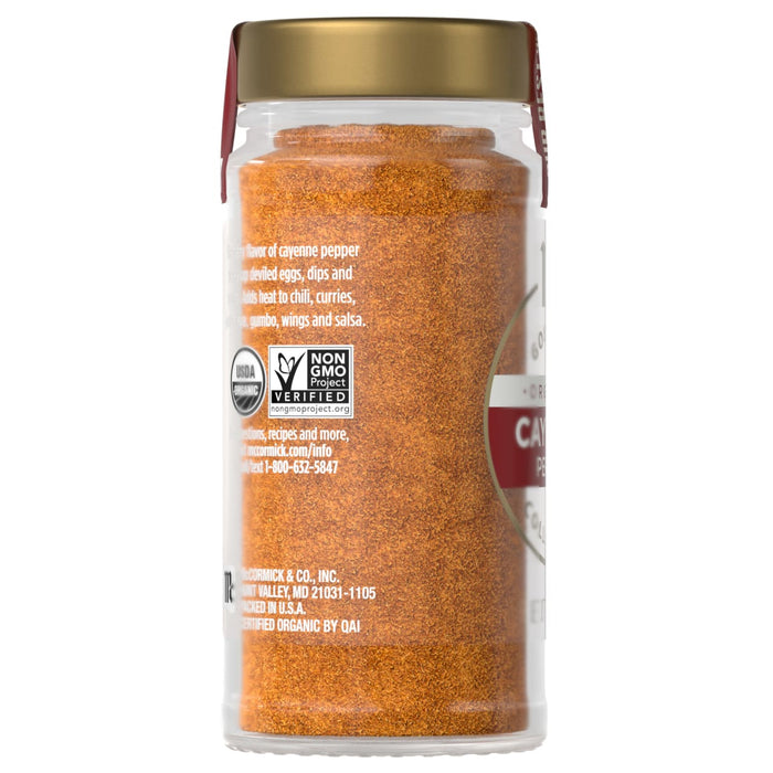 A jar of Simply Organic Cajun Seasoning is shown, highlighting its vibrant color and organic certification.