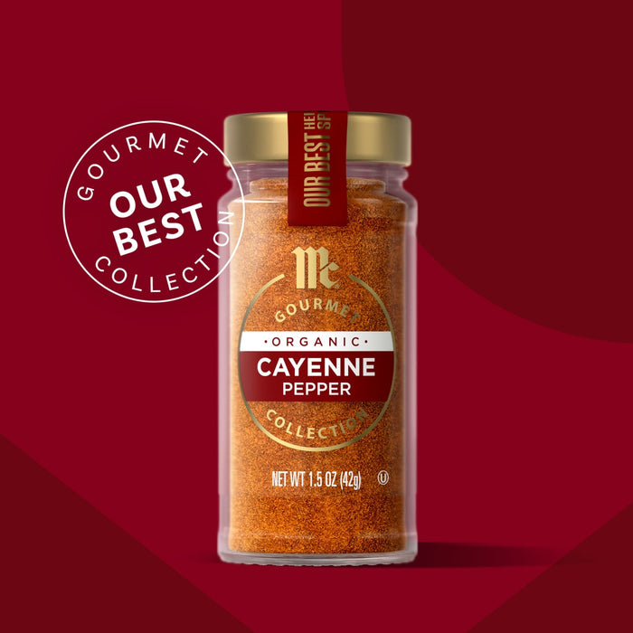 A jar of McCormick Gourmet Collection Cayenne Pepper is displayed against a red background, highlighted as part of the Our Best Collection.