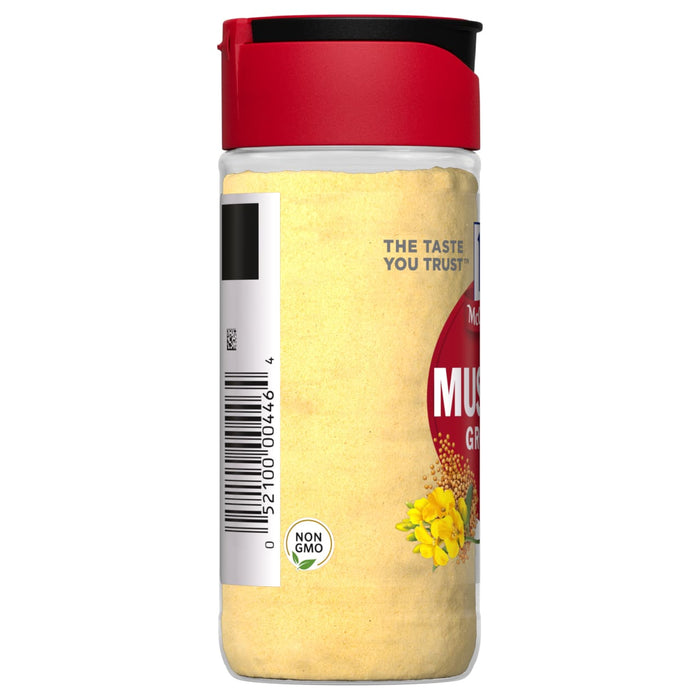 A container of McCormick Ground Mustard with a red lid.