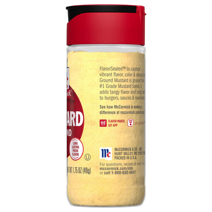 A McCormick Ground Mustard spice jar with a red lid.