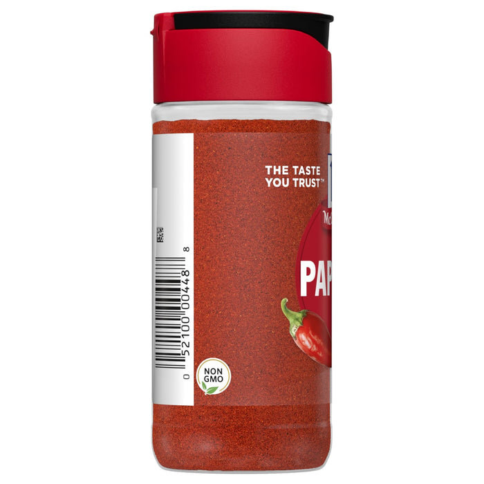 A glass jar of McCormick Paprika spice with a red lid and a red chili pepper on the label.