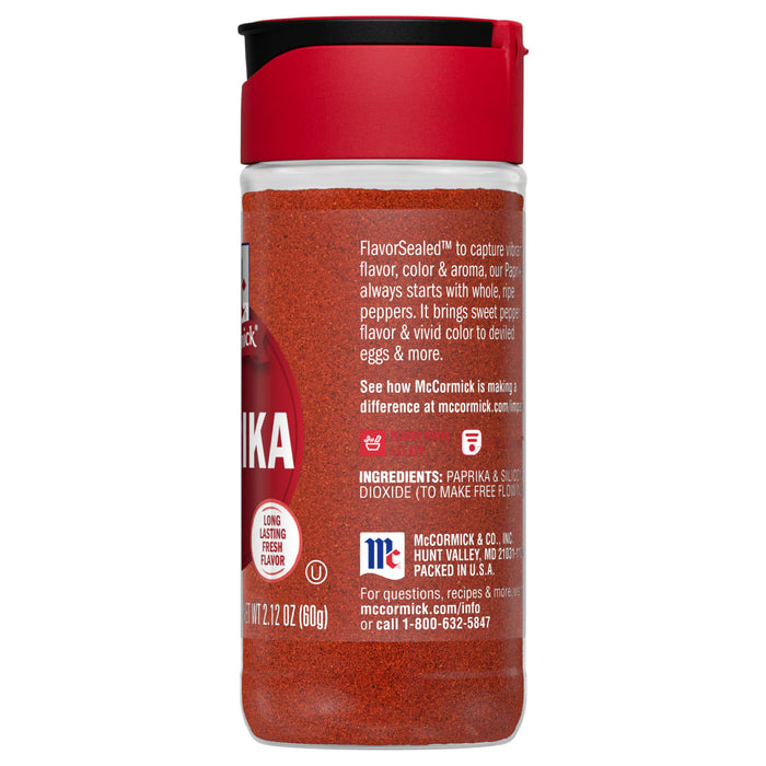A McCormick Paprika spice jar with a red lid and a red label.