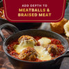 A close-up shot of meatballs and braised meat in a rich sauce, highlighting the depth of flavor.