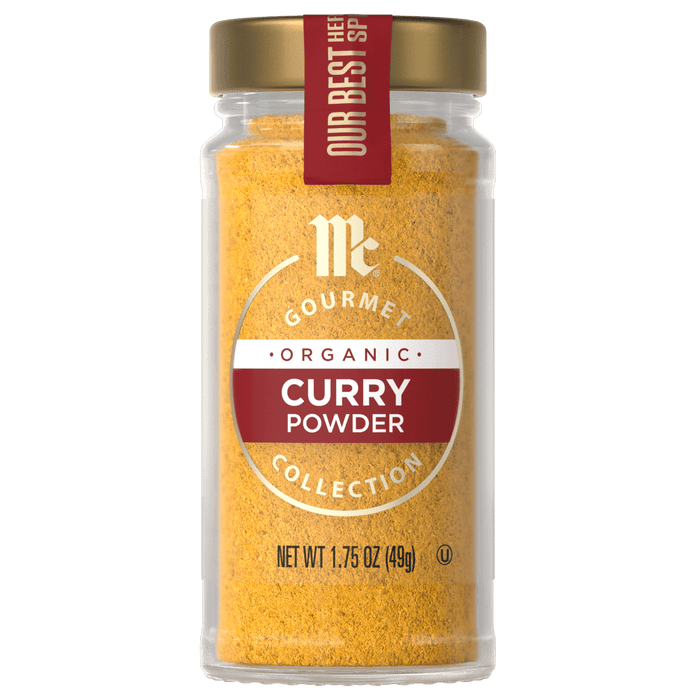 A jar of McCormick Gourmet Organic Curry Powder.