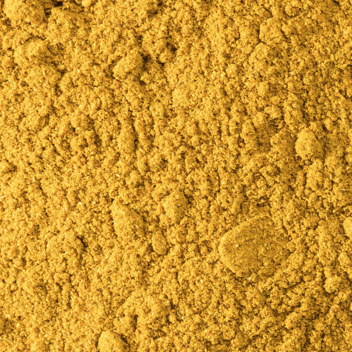 A close-up of vibrant yellow turmeric powder.