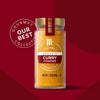 McCormick Gourmet Curry Powder in a glass jar with a gold lid and a label that says Our Best Collection.