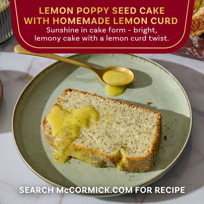 McCormick's Lemon Poppy Seed Cake with Homemade Lemon Curd is presented on a plate with a spoonful of lemon curd.