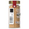 A McCormick Garlic Powder bottle with a gold lid and a red label.