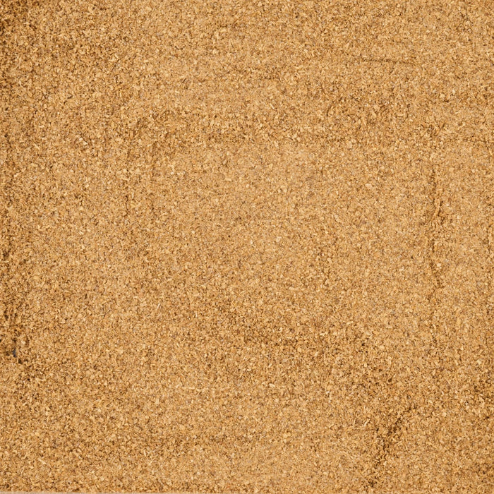 A textured background of fine, golden-brown particles.