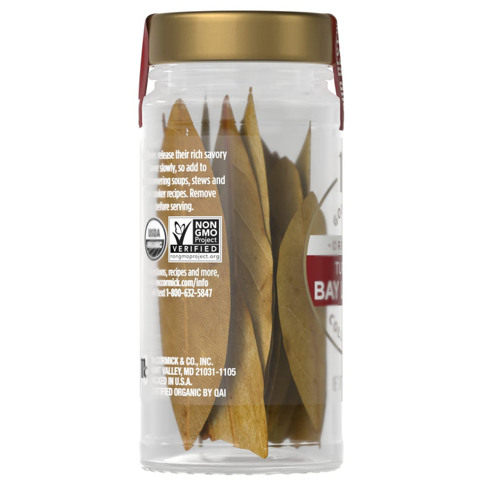 A jar of McCormick Organic Turkish Bay Leaves is shown, highlighting its non-GMO and organic certifications.