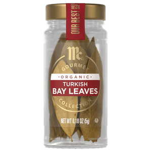 A jar of McCormick Gourmet Organic Turkish Bay Leaves is displayed, showcasing the products branding and contents.