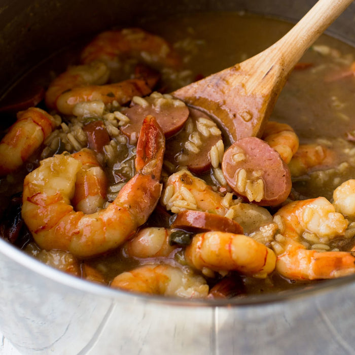 A pot of jambalaya with shrimp, sausage, and rice.