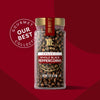 A jar of McCormick Gourmet Whole Black Peppercorns, part of their Our Best Collection.