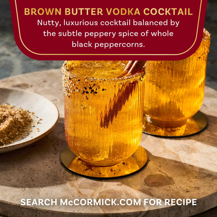 Illustration of mountains with a rising sun behind them.