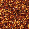 A close-up of crushed red pepper flakes, commonly used as a spice to add heat to dishes.