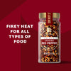 A jar of McCormick Crushed Red Pepper is displayed with the text Firey Heat For All Types of Food.