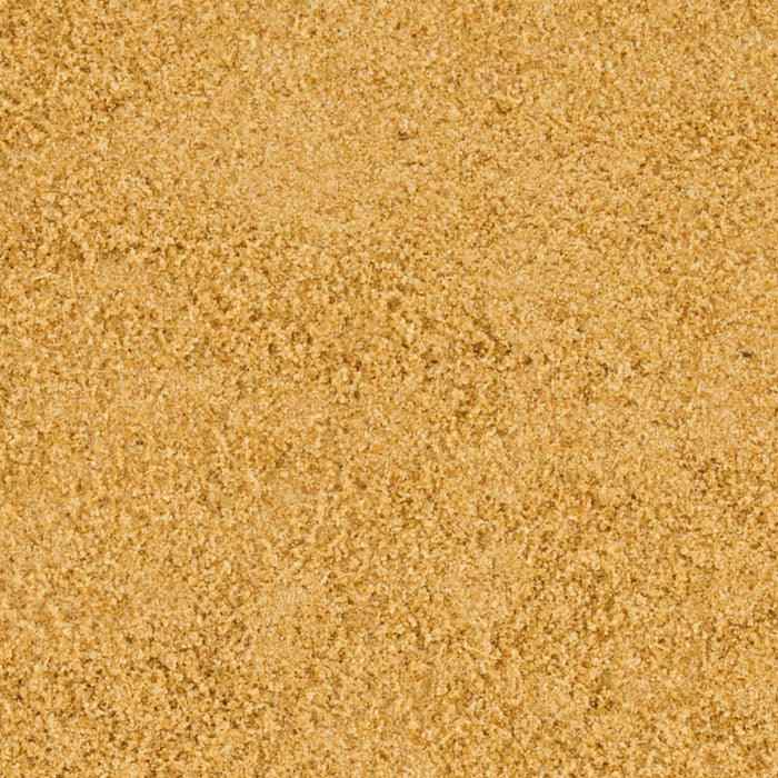 A close-up texture of brown sugar granules.