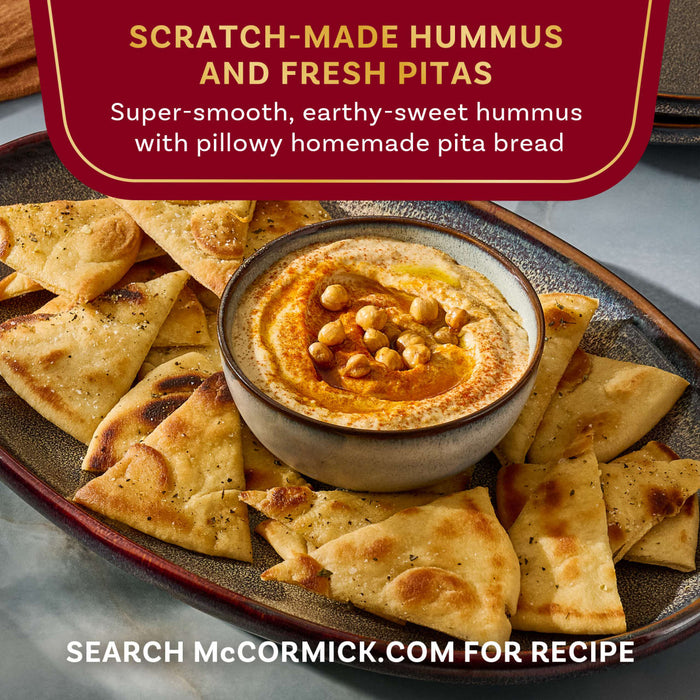 McCormick presents a plate of scratch-made hummus with fresh pita bread.