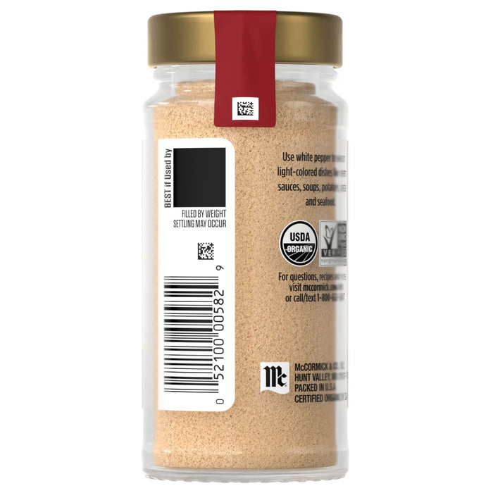 A jar of McCormick Organic Garlic Powder with a barcode and product information on the label.